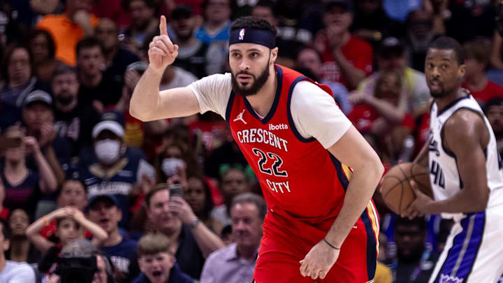 Apr 19, 2024; New Orleans, Louisiana, USA;  New Orleans Pelicans forward Larry Nance Jr. (22) reacts to making a basket against Sacramento Kings forward Harrison Barnes (40) in the second half during a play-in game of the 2024 NBA playoffs at Smoothie King Center. Mandatory Credit: Stephen Lew-Imagn Images