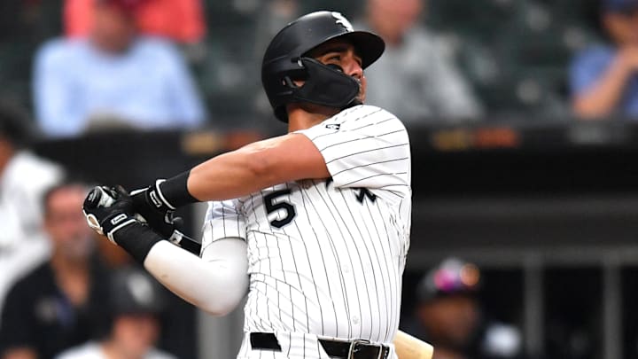 Jul 30, 2025; Chicago, Illinois, USA; Chicago White Sox third baseman Josh Rojas (5) hits a double during the seventh inning against the Philadelphia Phillies at Rate Field. Mandatory Credit: Patrick Gorski-Imagn Images