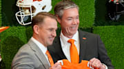OSU Athletic Director Chad Weiberg presents a jersey to Eric Morris. Oklahoma State University (OSU) introduces the new head football coach, Eric Morris, during a rally , Monday, Dec. 8, 2025.
