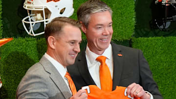 OSU Athletic Director Chad Weiberg presents a jersey to Eric Morris. Oklahoma State University (OSU) introduces the new head football coach, Eric Morris, during a rally , Monday, Dec. 8, 2025.