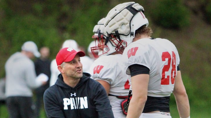 Wisconsin defensive coordinator Mike Tressel makes a point to linebacker Christian Alliegro during the team's final spring practice, which was held on the field north of Camp Randall Stadium on Thursday May 2, 2024 in Madison, Wisconsin.