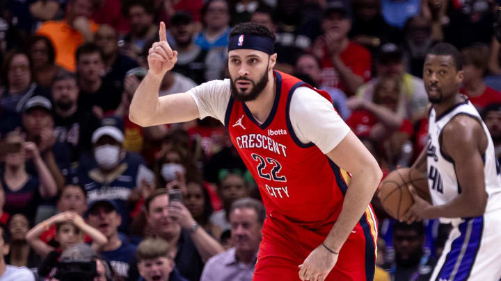 Apr 19, 2024; New Orleans, Louisiana, USA;  New Orleans Pelicans forward Larry Nance Jr. (22) reacts to making a basket against Sacramento Kings forward Harrison Barnes (40) in the second half during a play-in game of the 2024 NBA playoffs at Smoothie King Center. Mandatory Credit: Stephen Lew-USA TODAY Sports