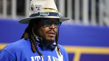 Dec 16, 2023; Atlanta, GA, USA; Former NFL quarterback Cam Newton watches a game between the Howard Bison and Florida A&M Rattlers in the first half at Mercedes-Benz Stadium. Mandatory Credit: Brett Davis-Imagn Images