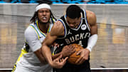 Indiana Pacers' Myles Turner and Milwaukee Bucks star Giannis Antetokounmpo battle for the ball during the 2025 NBA Playoffs