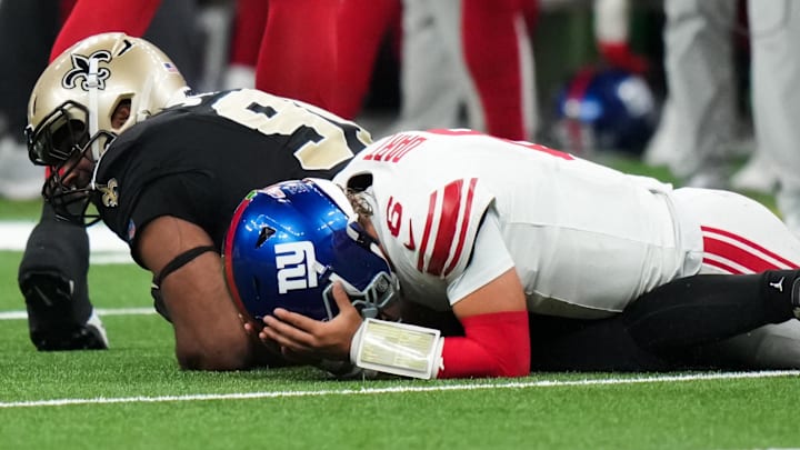 Oct 5, 2025; New Orleans, Louisiana, USA; New York Giants quarterback Jaxson Dart (6) reacts after fumbling the ball against the New Orleans Saints during the third quarter at Caesars Superdome. Mandatory Credit: Matthew Hinton-Imagn Images