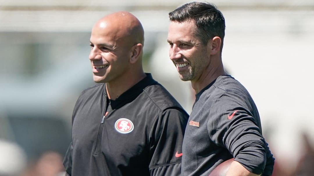 San Francisco 49ers defensive coordinator Robert Saleh smiles alongside head coach Kyle Shanahan as they watch players participate during training camp at the SAP Performance Facility. Mandatory Credit: Stan Szeto-Imagn Images