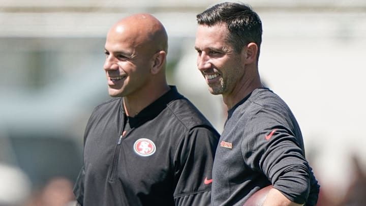 San Francisco 49ers defensive coordinator Robert Saleh smiles alongside head coach Kyle Shanahan as they watch players participate during training camp at the SAP Performance Facility. Mandatory Credit: Stan Szeto-Imagn Images