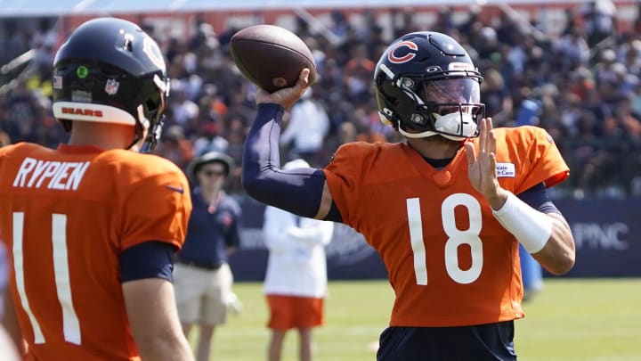 Caleb Williams and QBs go through warmups at training camp. Williams is expected to play against Buffalo on Saturday.