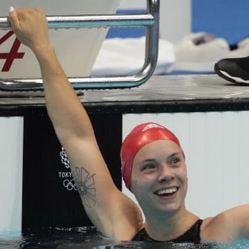 Anna Hopkin (GBR) celebrates after anchoring the relay team to victory in the mixed 4x100m medley relay final during the Tokyo 2020 Olympic Summer Games at Tokyo Aquatics Centre