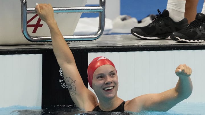 Anna Hopkin (GBR) celebrates after anchoring the relay team to victory in the mixed 4x100m medley relay final during the Tokyo 2020 Olympic Summer Games at Tokyo Aquatics Centre