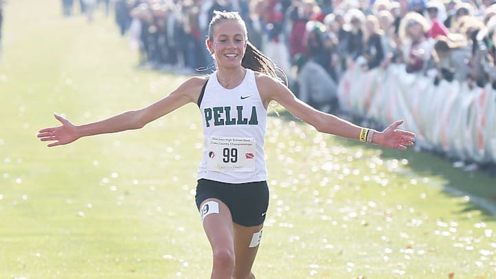 Pella’s Marissa Ferebee celebrates as finishing her race in the 3A high school girls cross Country at Lakeside Golf Course on Friday, Nov. 1, 2024, in Fort Dodge, Iowa. Pella’s Marissa Ferebee celebrates as finishing her race in the 3A high school girls cross Country at Lakeside Golf Course on Friday, Nov. 1, 2024, in Fort Dodge, Iowa.