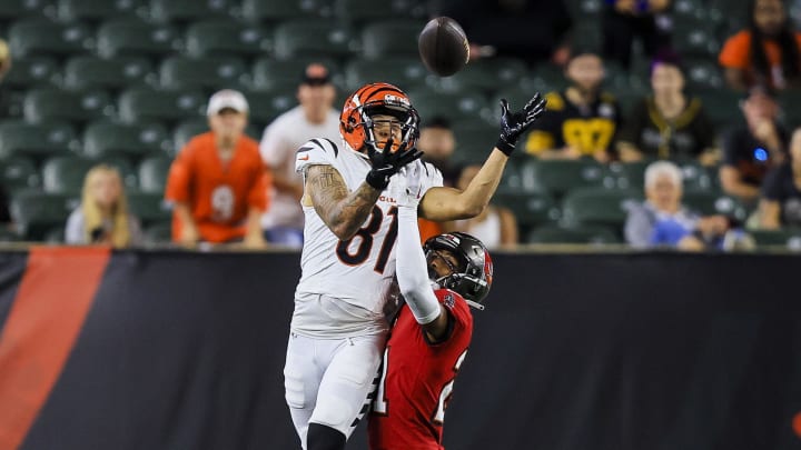 Aug 10, 2024; Cincinnati, Ohio, USA; Cincinnati Bengals wide receiver Jermaine Burton (81) catches a pass against Tampa Bay Buccaneers cornerback Andrew Hayes (21) in the second half at Paycor Stadium. Mandatory Credit: Katie Stratman-USA TODAY Sports