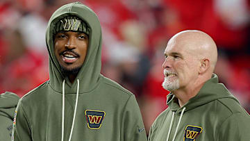 Washington Commanders quarterback Jayden Daniels and head coach Dan Quinn