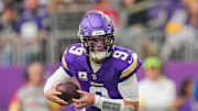 Nov 9, 2025; Minneapolis, Minnesota, USA; Minnesota Vikings quarterback J.J. McCarthy (9) scrambles against the Baltimore Ravens in the second quarter at U.S. Bank Stadium. Mandatory Credit: Brad Rempel-Imagn Images