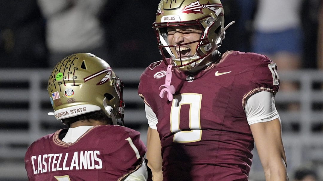 Nov 1, 2025; Tallahassee, Florida, USA; Florida State Seminoles quarterback Tommy Castellanos (1) celebrates a touchdown with wide receiver Duce Robinson (0) during the second half against the Wake Forest Demon Deacons at Doak S. Campbell Stadium. Mandatory Credit: Melina Myers-Imagn Images