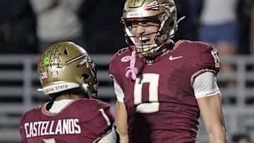 Nov 1, 2025; Tallahassee, Florida, USA; Florida State Seminoles quarterback Tommy Castellanos (1) celebrates a touchdown with wide receiver Duce Robinson (0) during the second half against the Wake Forest Demon Deacons at Doak S. Campbell Stadium. Mandatory Credit: Melina Myers-Imagn Images