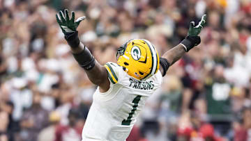 Oct 19, 2025; Glendale, Arizona, USA; Arizona Cardinals quarterback Jacoby Brissett (7) is sacked by Green Bay Packers defensive lineman Micah Parsons (1) in the second half at State Farm Stadium. Mandatory Credit: Mark J. Rebilas-Imagn Images
