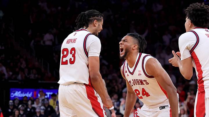 Mar 14, 2026; New York, NY, USA; St. John's Red Storm forward Zuby Ejiofor (24) celebrates with forward Bryce Hopkins (23) and guards Oziyah Sellers (4) and Dylan Darling (0) during the second half of the men's Big East Conference Tournament Championship game against the Connecticut Huskies at Madison Square Garden.