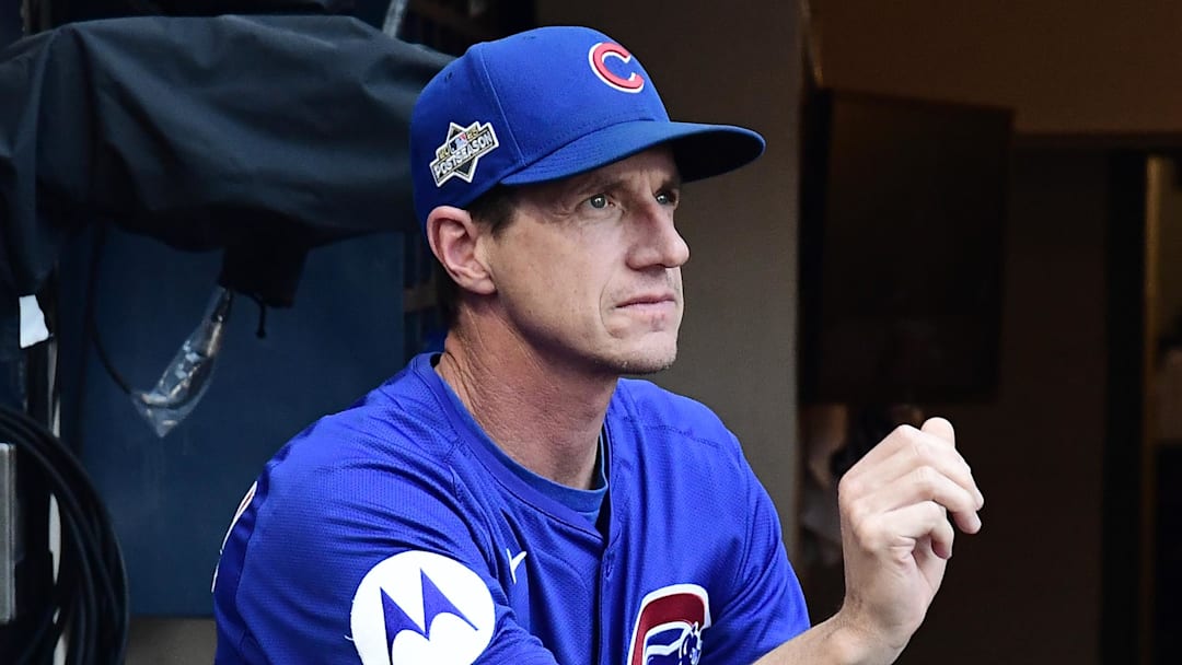 Craig Counsell of Chicago Cubs sits in dugout.