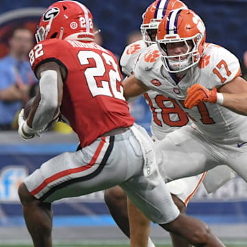 Aug 31, 2024; Atlanta, Georgia, USA; Clemson Tigers linebacker Wade Woodaz (17) tackles Georgia Bulldogs running back Branson Robinson (22) during the second quarter of the 2024 Aflac Kickoff Game at Mercedes-Benz Stadium. 