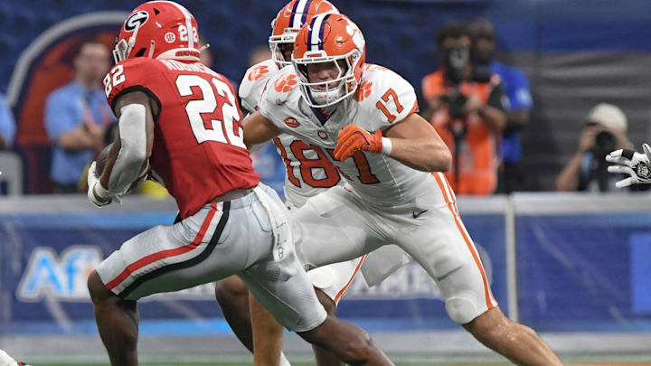 Aug 31, 2024; Atlanta, Georgia, USA; Clemson Tigers linebacker Wade Woodaz (17) tackles Georgia Bulldogs running back Branson Robinson (22) during the second quarter of the 2024 Aflac Kickoff Game at Mercedes-Benz Stadium. 