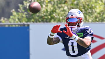 New England Patriots cornerback Christian Gonzalez (0) does a drill during training camp at Gillette Stadium.