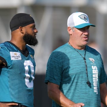 Jacksonville Jaguars wide receiver Gabe Davis (0) talks with Jacksonville Jaguars head coach Doug Pederson on the fifth day of the NFL football training camp practice session Monday, July 29, 2024 at EverBank Stadium's Miller Electric Center in Jacksonville, Fla..
