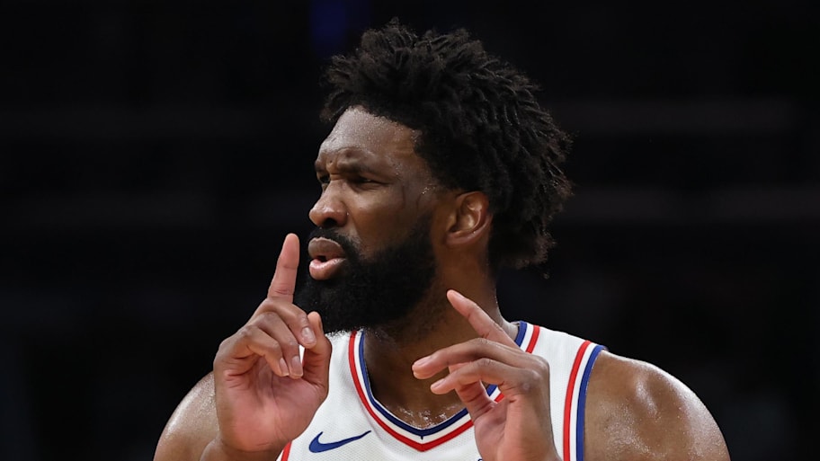 Philadelphia 76ers center Joel Embiid quiets the crowd after making a basket against the Boston Celtics.