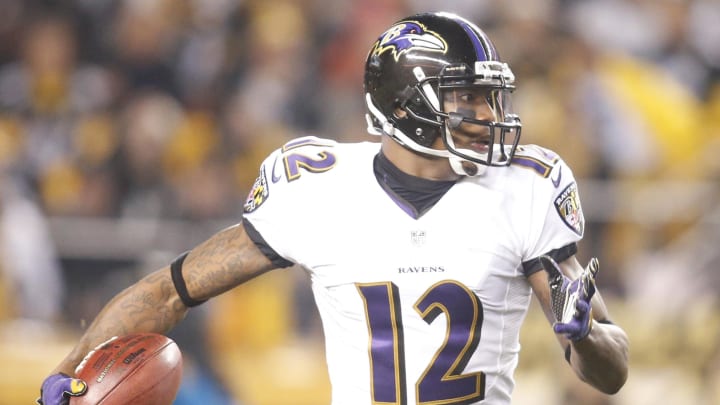 Jan 3, 2015; Pittsburgh, PA, USA; Baltimore Ravens wide receiver Jacoby Jones (12) returns a kick-off against the Pittsburgh Steelers during the first quarter in the 2014 AFC Wild Card playoff football game at Heinz Field. The Ravens won 30-17. Mandatory Credit: Charles LeClaire-USA TODAY Sports