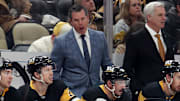 Nov 30, 2024; Pittsburgh, Pennsylvania, USA;  Pittsburgh Penguins head coach Mike Sullivan (rear) reacts on the bench against the Calgary Flames during the third period  at PPG Paints Arena. Mandatory Credit: Charles LeClaire-Imagn Images