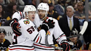 Chicago Blackhawks forward Buddy Robinson celebrates with Seth Jones after scoring against the Pittsburgh Penguins.