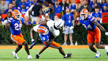 Florida Gators defensive back Jason Marshall Jr. (3) tackles Samford Bulldogs wide receiver Preston Bird (84) during the second half at Ben Hill Griffin Stadium in Gainesville, FL on Saturday, September 7, 2024 against the Samford Bulldogs. The Florida Gators won 45-7 over the Bulldogs. [Doug Engle/Gainesville Sun]