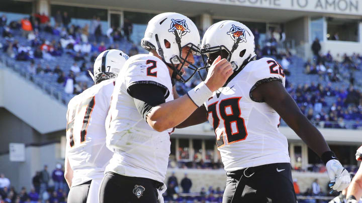 Nov 19, 2016; Fort Worth, TX, USA; Oklahoma State Cowboys quarterback Mason Rudolph (2) celebrates with  wide receiver James Washington (28) after running for a touchdown during the second half against the TCU Horned Frogs at Amon G. Carter Stadium. Mandatory Credit: Kevin Jairaj-USA TODAY Sports