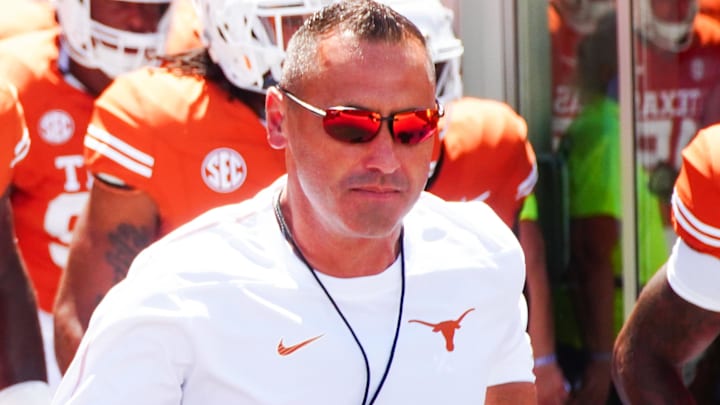 Texas Longhorns Head Coach Steve Sarkisian leads his team out onto the field at Darrell K Royal-Texas Memorial Stadium.