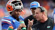 Sep 6, 2025; Gainesville, Florida, USA; Florida Gators head coach Billy Napier talks with Florida Gators quarterback DJ Lagway (2) against the South Florida Bulls during the first quarter at Ben Hill Griffin Stadium. Mandatory Credit: Kim Klement Neitzel-Imagn Images