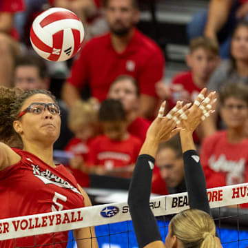 Nebraska middle blocker Rebekah Allick readies to fire a shot during the Red-White Scrimmage Saturday, while Andi Jackson defends for the white team.
