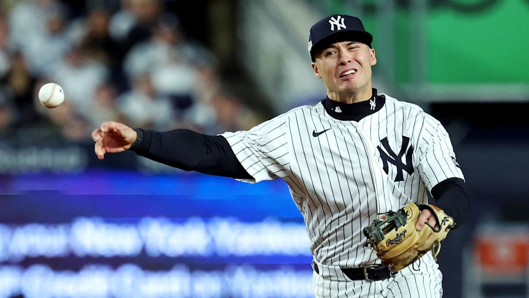 Oct 8, 2025; Bronx, New York, USA; New York Yankees shortstop Anthony Volpe (11) throws to first base for an out during the third inning against the Toronto Blue Jays during game four of the ALDS round for the 2025 MLB playoffs at Yankee Stadium. Mandatory Credit: Vincent Carchietta-Imagn Images