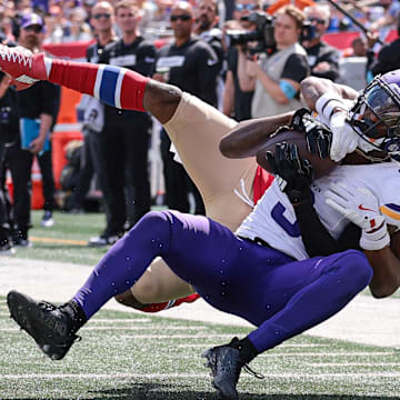 Sep 8, 2024; East Rutherford, New Jersey, USA; Minnesota Vikings wide receiver Jordan Addison (3) is tackled by New York Giants cornerback Dru Phillips (22) during the first half at MetLife Stadium.