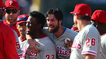 Jul 25, 2015; Chicago, IL, USA; Philadelphia Phillies starting pitcher Cole Hamels (35) and center fielder Odubel Herrera (37) celebrate after defeating the Chicago Cubs 5-0 at Wrigley Field. Mandatory Credit: Caylor Arnold-Imagn Images