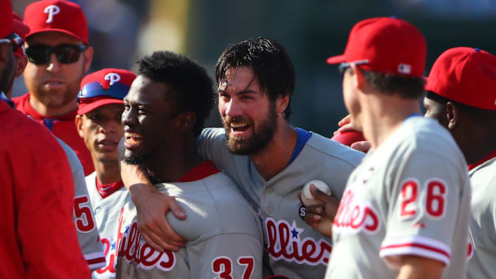 Jul 25, 2015; Chicago, IL, USA; Philadelphia Phillies starting pitcher Cole Hamels (35) and center fielder Odubel Herrera (37) celebrate after defeating the Chicago Cubs 5-0 at Wrigley Field. Mandatory Credit: Caylor Arnold-Imagn Images