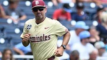 Jun 18, 2024; Omaha, NE, USA; Florida State Seminoles head coach Link Jarrett heads to the dugout before a game against the North Carolina Tar Heels at Charles Schwab Field Omaha. Mandatory Credit: Steven Branscombe-Imagn Images