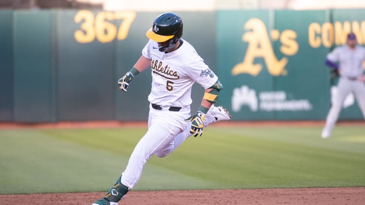 May 21, 2024; Oakland, California, USA; Oakland Athletics designated hitter J.D. Davis (5) rounds the bases after hitting a home run against the Colorado Rockies during the third inning at Oakland-Alameda County Coliseum. 