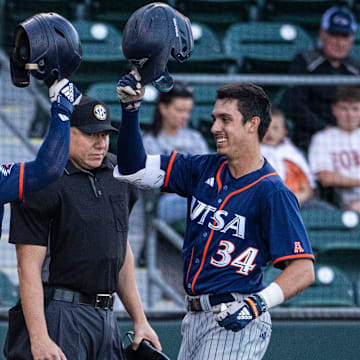 UTSA utility Caden Miller (34) celebrates with outfielder Mason Lytle (3) after scoring the first run of the game against the Texas Longhorns, March 18, 2025 at UFCU Disch-Falk Field in Austin.