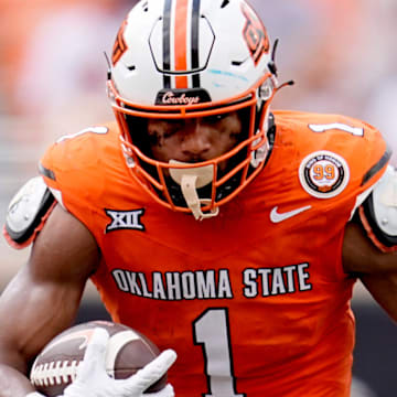 Oklahoma State's De'Zhaun Stribling (1) gets by South Dakota State's Myles Taylor (2) after a reception in the second half of the college football game between the Oklahoma State Cowboys and South Dakota State Jackrabbits at Boone Pickens Stadium in Stillwater, Okla., Saturday, Aug., 31, 2024.