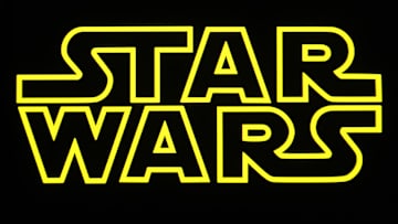 In this photo illustration, a Star Wars logo is seen on a...
