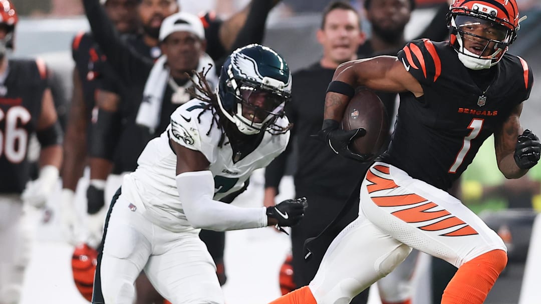 Aug 7, 2025; Philadelphia, Pennsylvania, USA; Cincinnati Bengals wide receiver Ja'Marr Chase (1) runs for a touchdown past Philadelphia Eagles cornerback Kelee Ringo (7) after a catch during the first quarter at Lincoln Financial Field. Mandatory Credit: Bill Streicher-Imagn Images