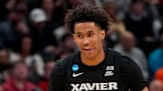 Xavier Musketeers guard Dailyn Swain (3) smiles after sinking a three pointer in the first half of the NCAA Tournament First Round game between the Illinois Fighting Illini and the Xavier Musketeers at Fiserv Forum in Milwaukee on Friday, March 21, 2025. Xavier was eliminated from the tournament, losing 86-73, to Illinois.