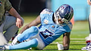 Tennessee Titans wide receiver Calvin Ridley grabs his leg after the offense’s first play of the game.