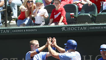 May 4, 2025; Arlington, Texas, USA;  Texas Rangers left fielder Wyatt Langford (36) celebrates with Texas Rangers center fielder Josh Smith (8) after scoring during the third inning against the Seattle Mariners at Globe Life Field. Mandatory Credit: Kevin Jairaj-Imagn Images