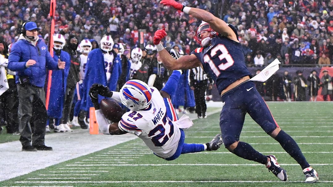 Dec 14, 2025; Foxborough, Massachusetts, USA; Buffalo Bills cornerback Tre'Davious White (27) intercepts a pass intended for New England Patriots wide receiver Mack Hollins (13) during the second half at Gillette Stadium